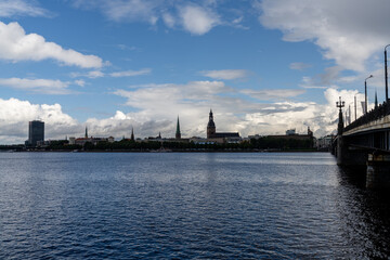 Fototapeta premium the Daugava River and Akmens Tilts Bridge with the skyline of Riga in the background