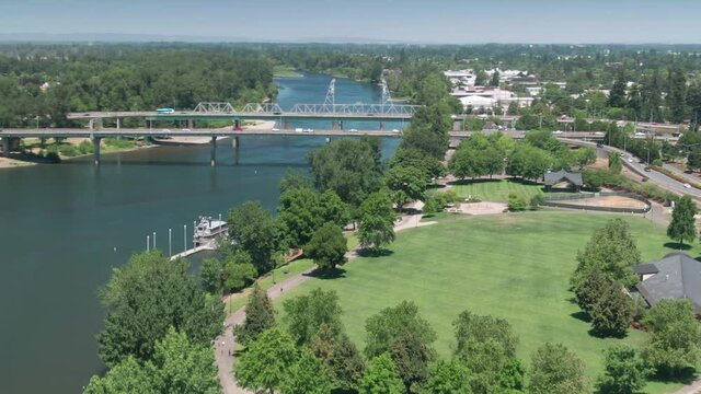 Aerial: Freeway bridges crossing the Willamette River, Salem, Oregon, USA