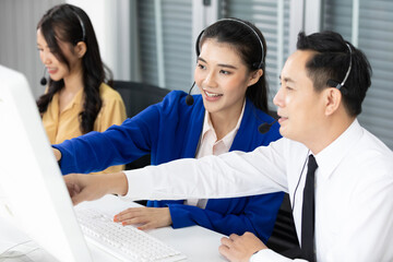 woman operator training and suggesting about work with colleagues at call center service