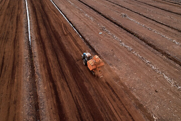 Peat Harvester Tractor on Collecting Extracting Peat. Mining and harvesting peatland. Area drained...