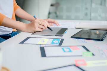 Creative Web Designer planning application and developing template layout, framework for mobile phone. User experience (UX) concept.