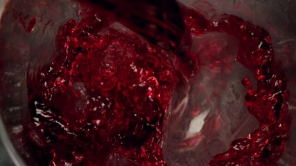 Super slow motion of pouring red wine into glass with camera motion. Unique angle with underwater macro lens.  Speed ramp effect. Filmed on high speed cinema camera, 1000 fps. - Powered by Adobe