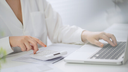 Business Professional Chartered Accountant Woman working with computer and calculator Sales Invoice Accounting