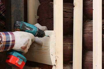 Decorative protection of walls from logs of an old wooden house block house