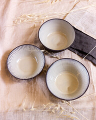 Modern serving with ceramic tableware on a light background top view