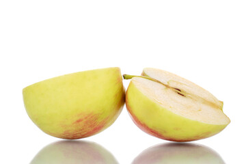 Two halves of a juicy apple, close-up, isolated on white.