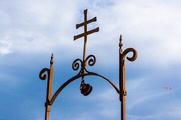 Antique cross smithy on a cloudy day 