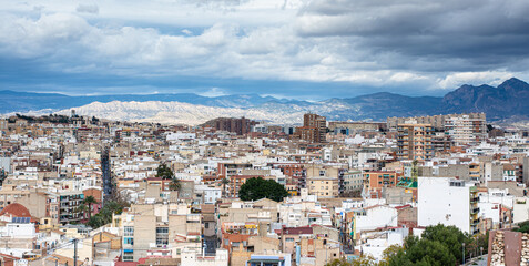 Fototapeta na wymiar Horizontal view of the city of Alicante on a cloudy day 
