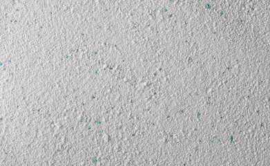 Washing powder with colorful granules, detergent background and texture