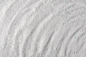 Washing powder with colorful granules, detergent background and texture