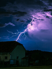 Bolt from the blue: a branching bolt of lightning strikes down far away from the storm