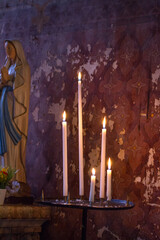 spiritual or religious light with altar candles by Virgin Mary