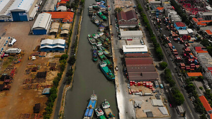 aerial view cargo and passenger seaport with ships and crane Tanjung Perak, surabaya, indonesia. docks for the repair and parking of ships, cargo port and container terminal. ship in industrial port