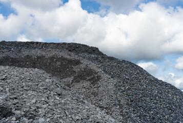 Stone or Concrete Mixer.Gravel pile used to make concrete , to mix with asphalt , to create road or...