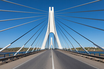 Fototapeta na wymiar Suspension bridge and one of the largest suspension bridges in Portugal. Sunny day, travel concept
