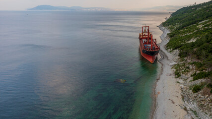 Sea tanker, dry cargo ship, washed ashore after a storm, aerial view