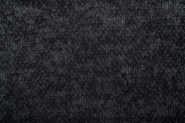 Cloth. The background is made of dark colored fabric. A texture or pattern from a material. A piece of fabric for the work of a designer, fashion designer or seamstress. Wool