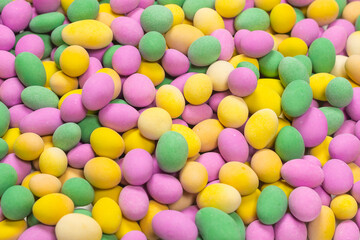 Group of colorful peanuts in glaze.