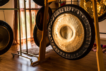 Set of musical instruments and gongs in room prepared for meditation and yoga
