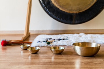 Set of musical instruments composed of Tibetan bowls and gongs in a room prepared for meditation...