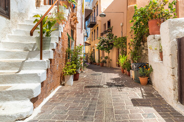 Fototapeta na wymiar white stairs and charming streets of the old town of Chani on the island of Crete