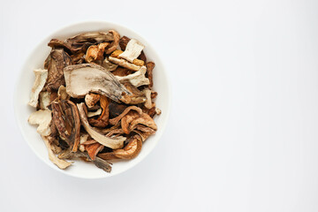 Fototapeta na wymiar plate with dried porcini mushrooms