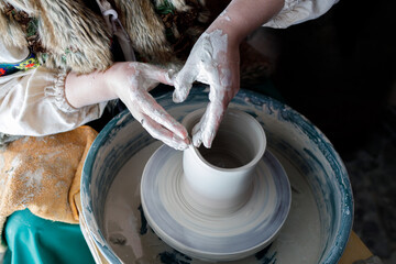 the potter makes the walls of the pot thinner