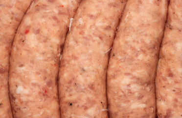 Pork chopped sausages top view.Background of pork sausages.Sausages made of minced pork.