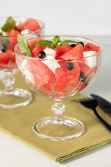 Organic salad of watermelon, feta cheese and currant.
