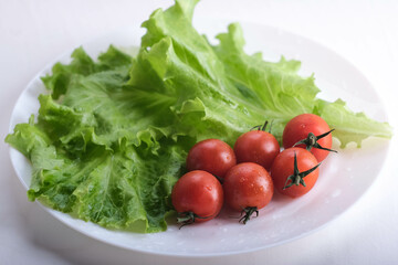 Crispy cracker with herbs and cherries. Still life of eating cookies with sauce and herbs and tomatoes.
