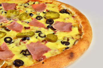 pizza with ham Cornish mushrooms, cheese and salami closeup