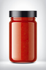 Glass Jar with Tomato Sauce on Background. 