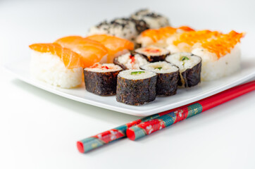 Set of smoked salmon nigiri, Ebi king prawn nigiri, sweet chilli pawn and red pepper California...