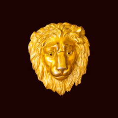 Golden sad lion head sculpture isolated on dark background