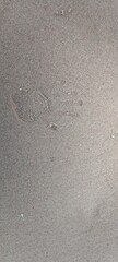 handprint footprints on the sea sand. sand beach