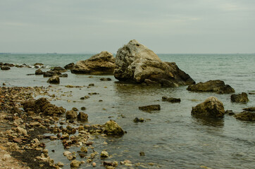 Fototapeta na wymiar rocks in the sea off the coast