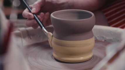 Making Pottery - Adding Slip To Pot