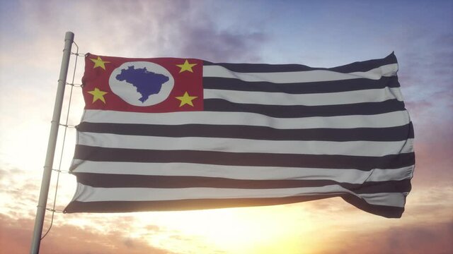 Sao Paulo State Flag waving in the wind, sky and sun background
