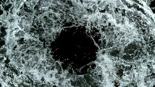 Super slow motion of water vortex on black background. Filmed on high speed cinema camera, 1000 fps.