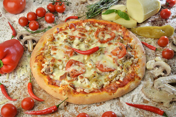 meat pizza with cheese tomato and mushrooms on wooden table with ingredients background.top view