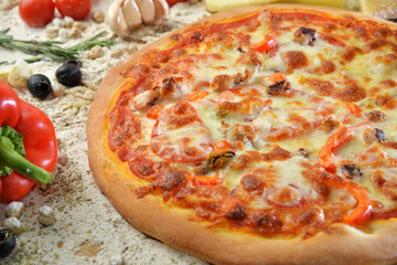 delicious pizza with seafood served on wooden table with ingredients