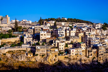Jerusalem, Israel. view on Silwan or Siloam is arab neighborhood in East Jerusalem, on outskirts of Old City of Jerusalem. Part it builted atop necropolis cemetery of ancient Judea