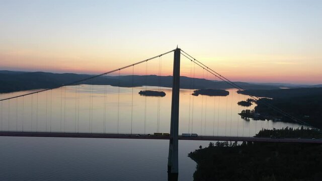 Hoga kusten bridge in Sweden, aerial flying footage of the famous bridge at sunset