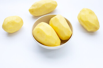 Raw peeled potatoes on white background
