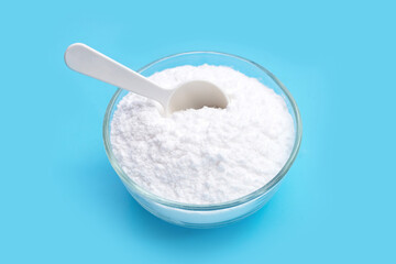Baking soda on blue background.