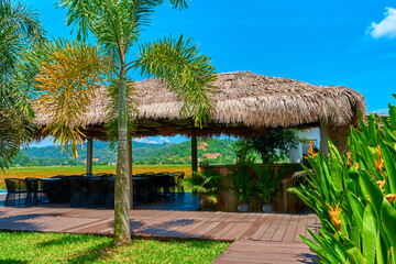 Lounge with a tropical mountain landscape. Terrace with a shelter by the pool overlooking the mountains.