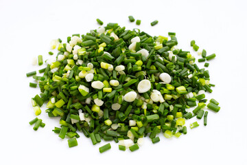 Chopped spring onions on white background.