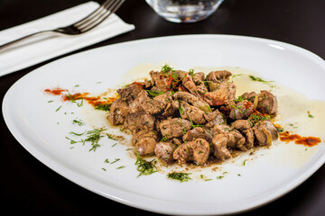 Braised beef meat cubes in white porcelain plate