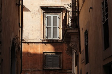 Fototapeta na wymiar Rome Street View with Old Building Facades, Balcony and Windows, Piazza Navona Area, Italy
