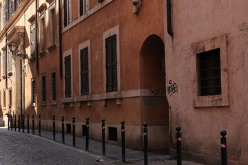 Fototapeta na wymiar Rome Street View with Buildings and Closed Windows with Shutters, Italy
